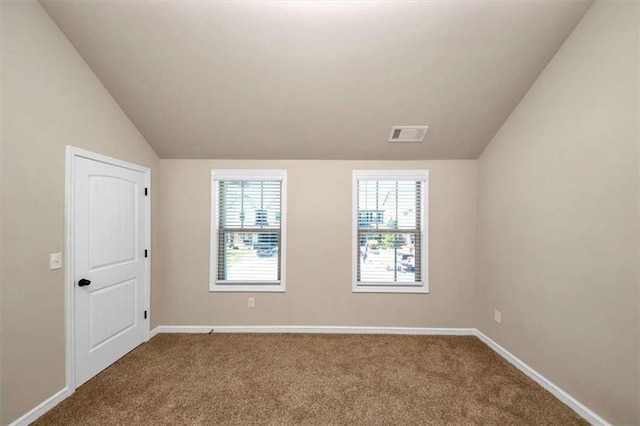 2375 Walker Dr, Hampton, GA 30228 - empty room featuring carpet flooring, visible vents, baseboards, and lofted ceiling