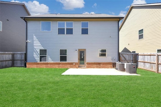 2375 Walker Dr, Hampton, GA 30228 - back of house with a patio, a yard, a fenced backyard, and central AC