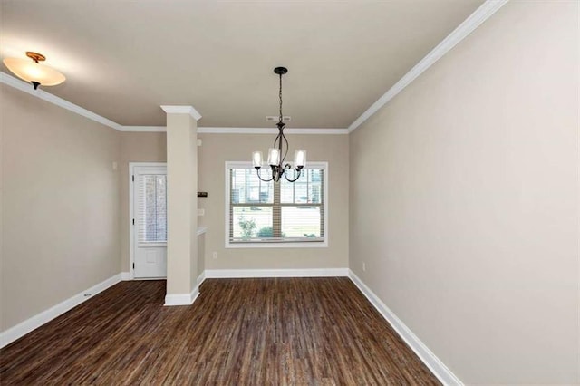 2375 Walker Dr, Hampton, GA 30228 - unfurnished dining area featuring dark wood-type flooring, ornamental molding, baseboards, and a chandelier