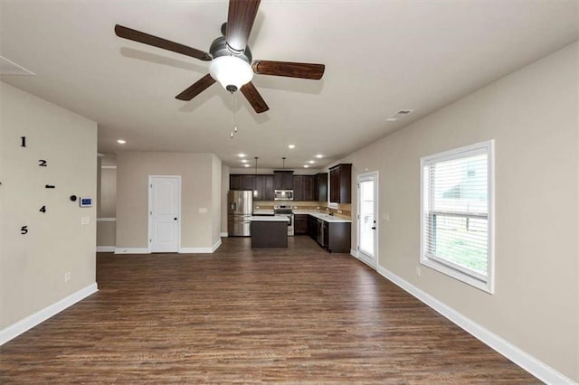 2375 Walker Dr, Hampton, GA 30228 - unfurnished living room with ceiling fan, visible vents, recessed lighting, dark wood-style flooring, and baseboards