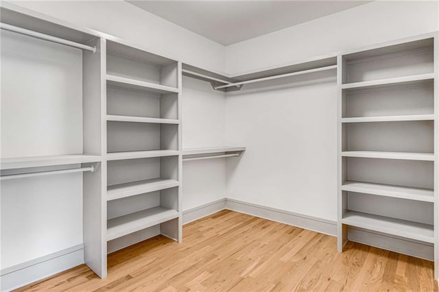 spacious closet with wood finished floors