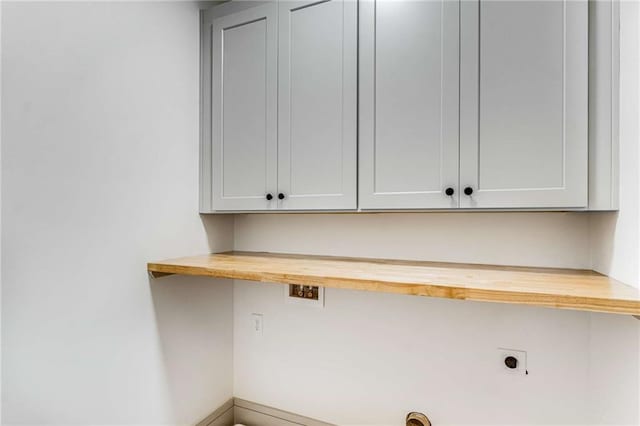 laundry area featuring cabinet space and hookup for an electric dryer