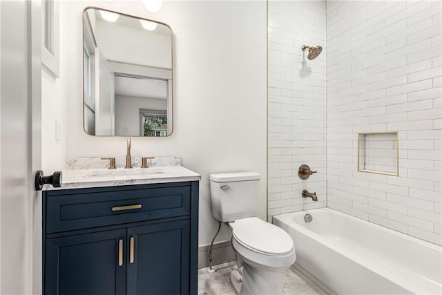 bathroom with toilet, bathing tub / shower combination, baseboards, and vanity