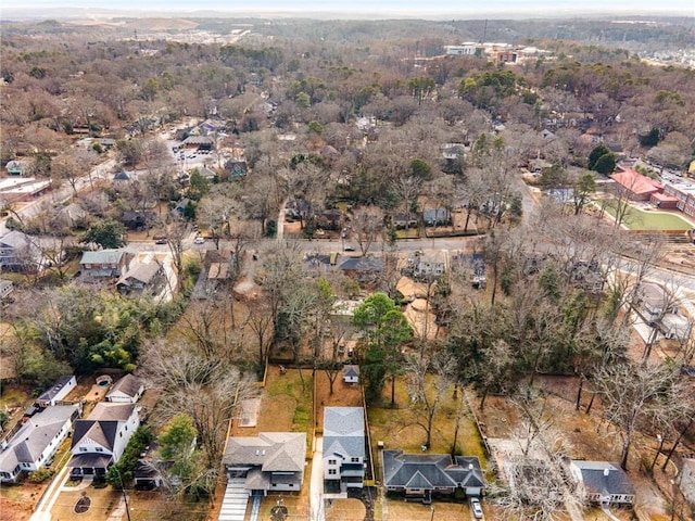 aerial view featuring a forest view and a residential view