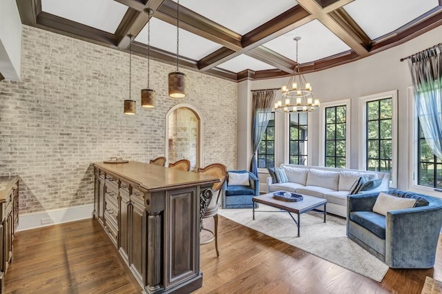 4317 Oglethorpe Loop NW, Acworth, GA 30101 - living area with coffered ceiling, dark wood-style floors, beamed ceiling, a chandelier, and brick wall