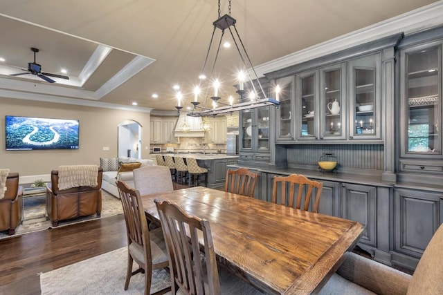 4317 Oglethorpe Loop NW, Acworth, GA 30101 - dining room featuring ornamental molding, ceiling fan, dark wood-style flooring, recessed lighting, and arched walkways