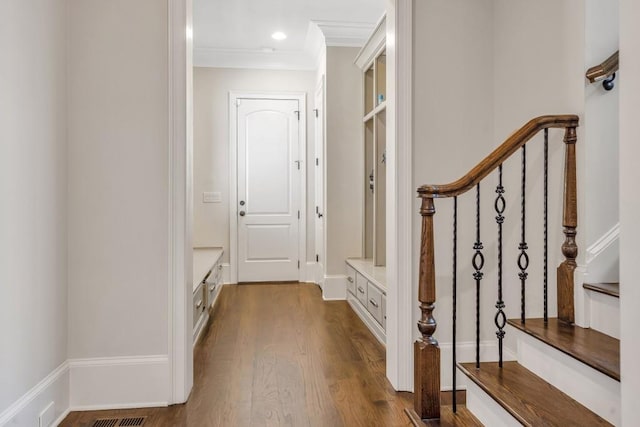4317 Oglethorpe Loop NW, Acworth, GA 30101 - hallway with dark wood-type flooring, ornamental molding, and stairs