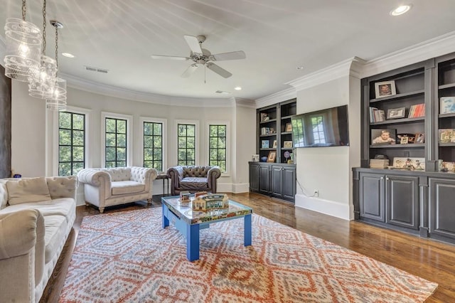 4317 Oglethorpe Loop NW, Acworth, GA 30101 - living room with healthy amount of natural light, wood finished floors, recessed lighting, crown molding, and ceiling fan