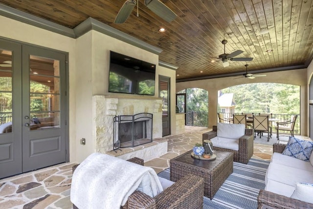 4317 Oglethorpe Loop NW, Acworth, GA 30101 - view of patio with french doors, ceiling fan, an outdoor living space with a fireplace, and outdoor dining space