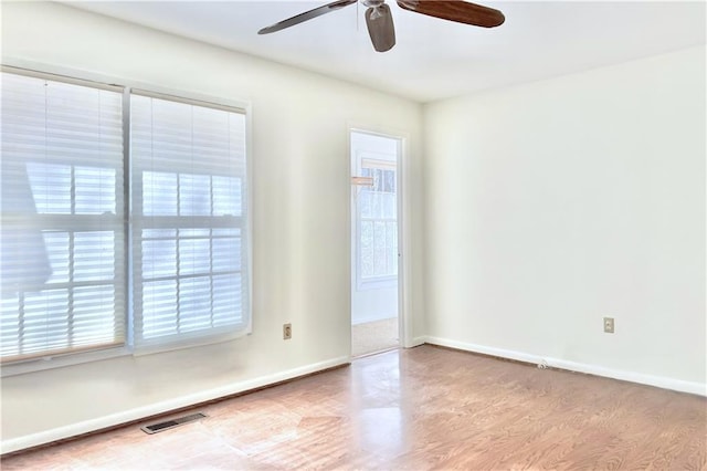 spare room featuring ceiling fan and light hardwood / wood-style floors