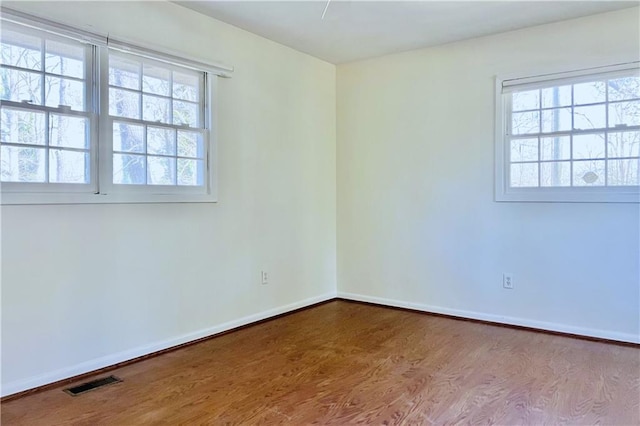 empty room featuring hardwood / wood-style flooring