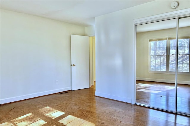 spare room featuring hardwood / wood-style flooring