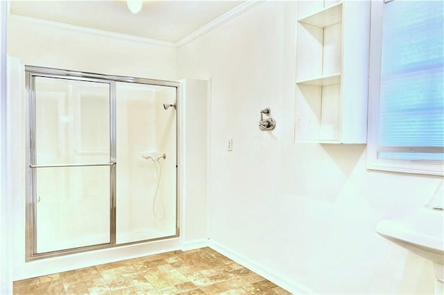 bathroom with walk in shower and ornamental molding