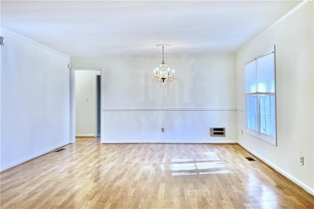 unfurnished room with light wood-type flooring, ornamental molding, heating unit, and a notable chandelier