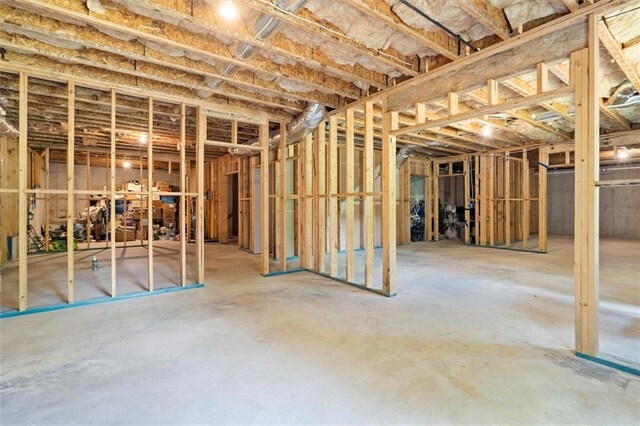 misc room with unfinished concrete floors