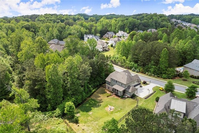 aerial view with a forest view and a residential view