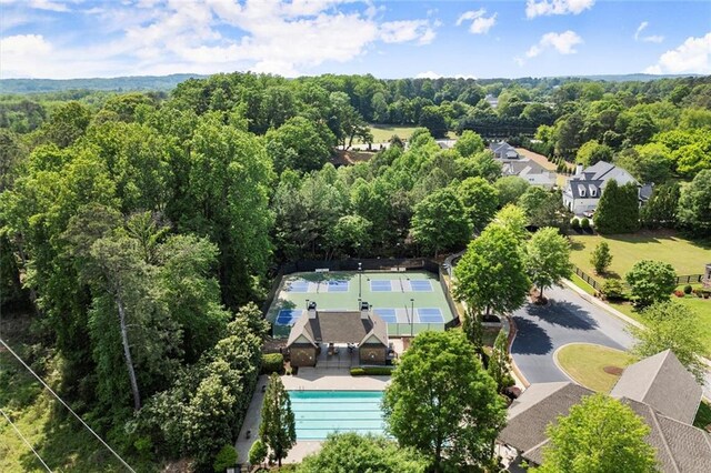 drone / aerial view with a view of trees