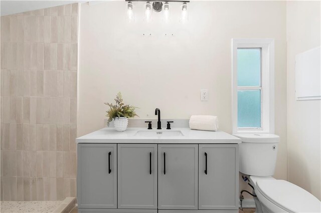 1010 Martin Ln, Canton, GA 30114 - bathroom with a tile shower, plenty of natural light, and vanity