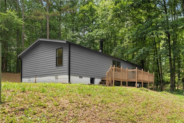1010 Martin Ln, Canton, GA 30114 - view of home's exterior featuring crawl space and a deck