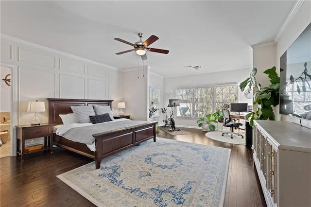 bedroom featuring crown molding, dark wood-style flooring, ceiling fan, and an office area