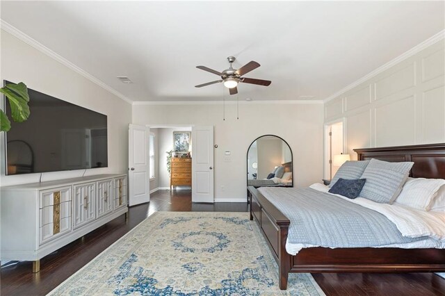 bedroom with crown molding, dark wood-style floors, ceiling fan, and baseboards