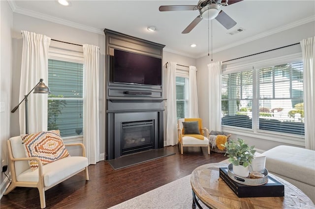 living room with dark wood-style floors, a large fireplace, recessed lighting, ceiling fan, and ornamental molding