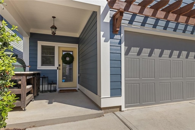 doorway to property featuring a garage