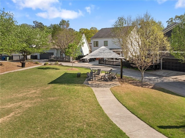 view of community featuring a gazebo and a yard