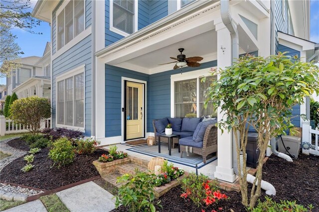 property entrance with a ceiling fan and covered porch