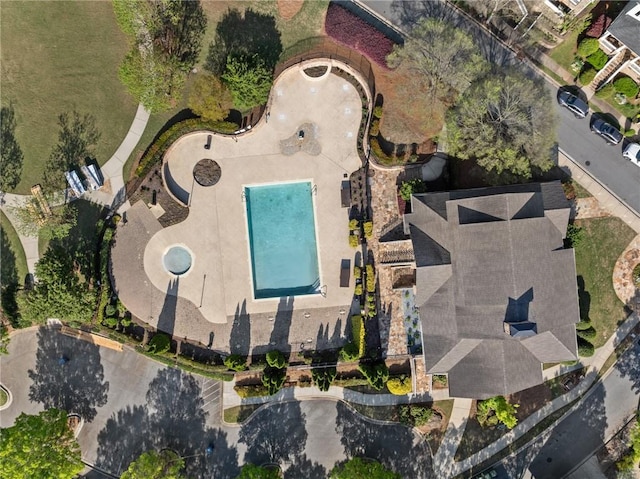 aerial view of property's location featuring a pool area