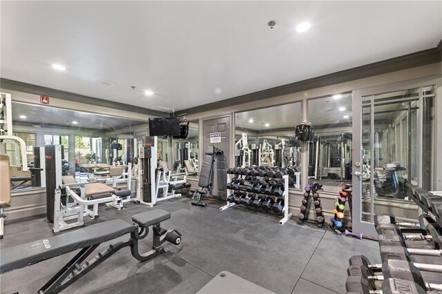 exercise room featuring crown molding and recessed lighting