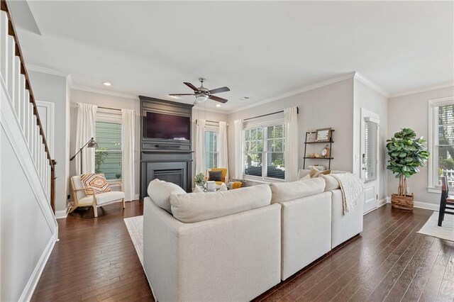 living room featuring dark wood-type flooring, plenty of natural light, stairway, recessed lighting, and baseboards