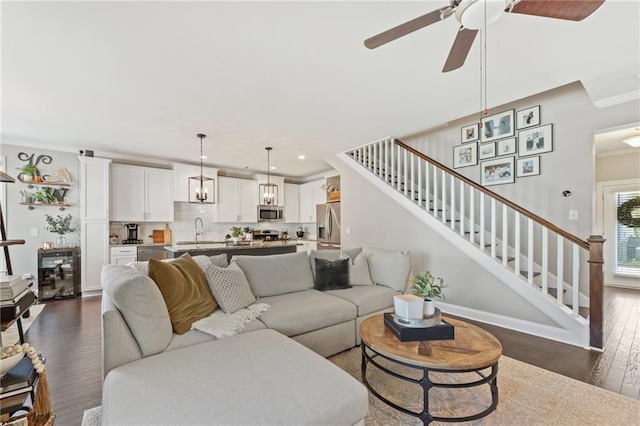 living room featuring stairway, dark wood-style floors, recessed lighting, wine cooler, and a ceiling fan