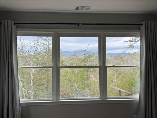 dining space with a mountain view and a wealth of natural light