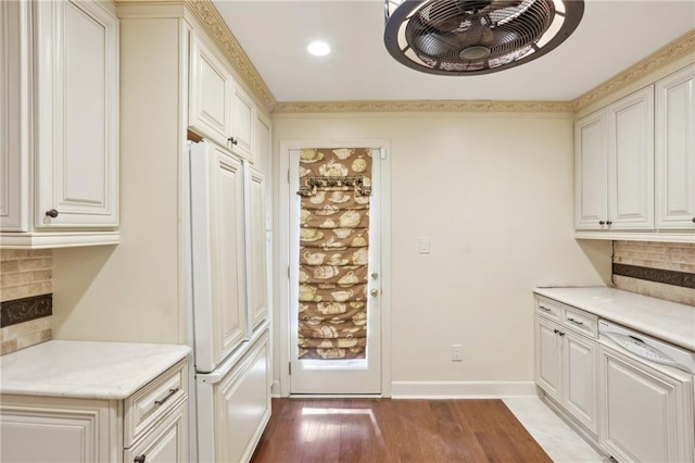 interior space featuring high end refrigerator, tasteful backsplash, and wood-type flooring