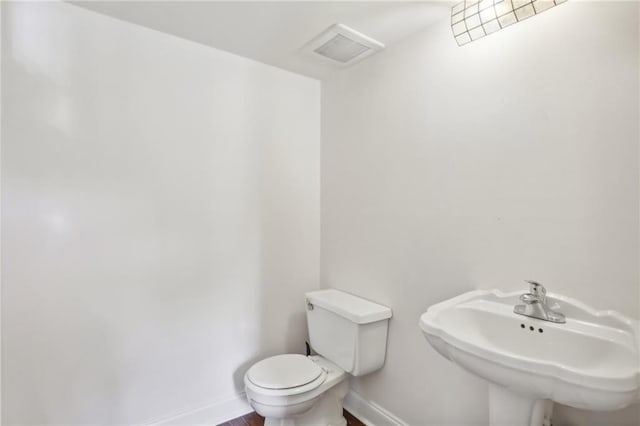 bathroom with toilet and sink