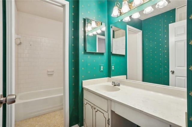 bathroom featuring vanity and tiled shower / bath combo