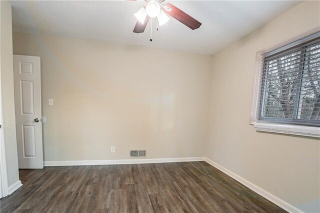 unfurnished room featuring ceiling fan and dark hardwood / wood-style floors