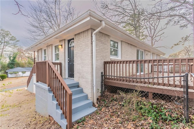 view of property exterior featuring a deck