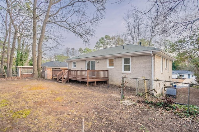 back of property featuring a wooden deck