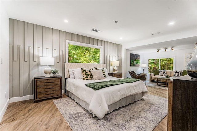 bedroom featuring recessed lighting, light wood-style flooring, visible vents, and baseboards