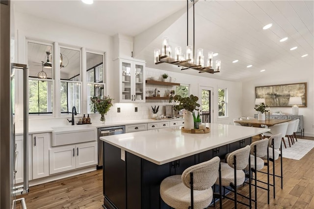 221 Brooke Dr, Alpharetta, GA 30009 - kitchen featuring dishwasher, recessed lighting, a sink, a kitchen island, and wood finished floors
