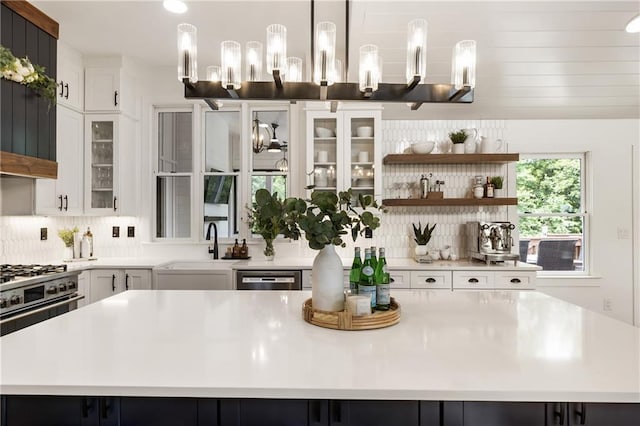 221 Brooke Dr, Alpharetta, GA 30009 - kitchen with a center island, open shelves, light countertops, backsplash, and recessed lighting