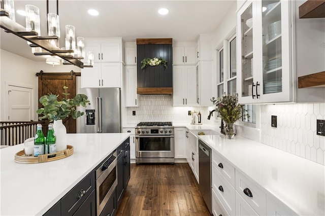 221 Brooke Dr, Alpharetta, GA 30009 - kitchen with premium appliances, white cabinetry, light countertops, recessed lighting, and hanging light fixtures