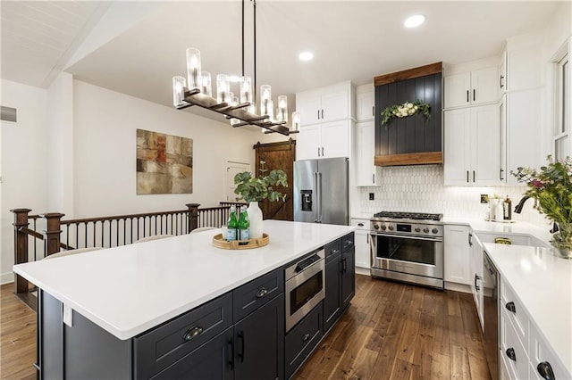 221 Brooke Dr, Alpharetta, GA 30009 - kitchen with high end appliances, white cabinets, light countertops, dark wood-style flooring, and recessed lighting