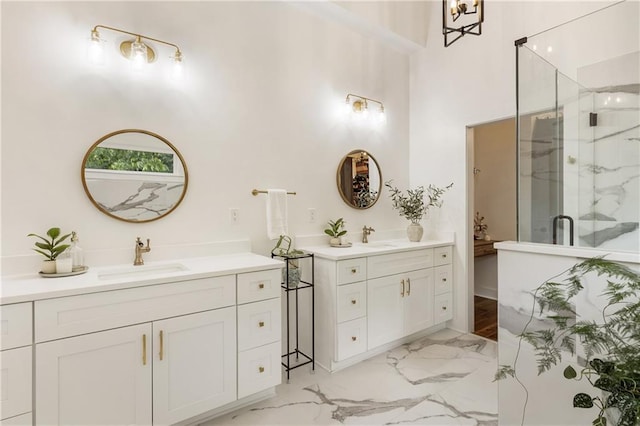 221 Brooke Dr, Alpharetta, GA 30009 - full bath with marble finish flooring, two vanities, a marble finish shower, and a towering ceiling