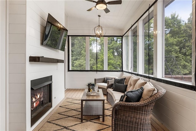 221 Brooke Dr, Alpharetta, GA 30009 - sunroom / solarium with plenty of natural light, lofted ceiling, wood walls, and wood finished floors