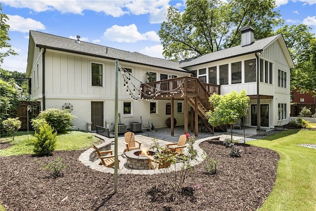 221 Brooke Dr, Alpharetta, GA 30009 - back of property featuring an outdoor fire pit, a patio, a sunroom, and a deck