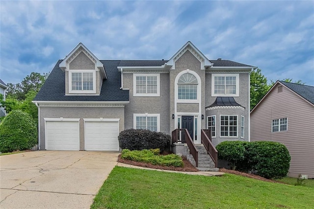 1706 Brandon Lee Way SW, Marietta, GA 30008 - view of front of property featuring driveway, a front lawn, an attached garage, and stucco siding