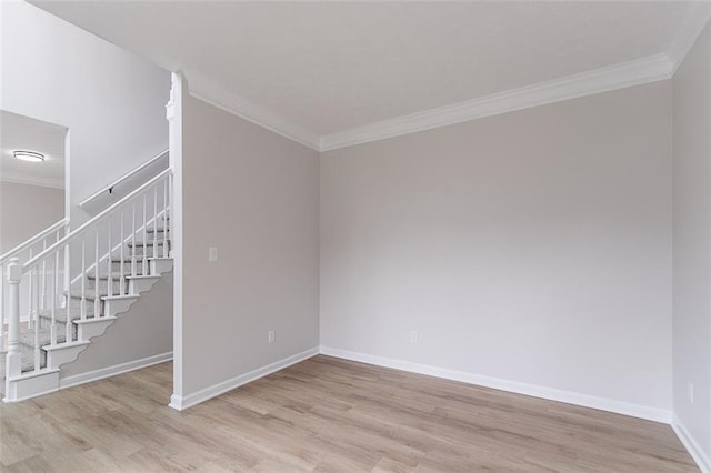 1706 Brandon Lee Way SW, Marietta, GA 30008 - spare room featuring ornamental molding, light wood-type flooring, stairs, and baseboards